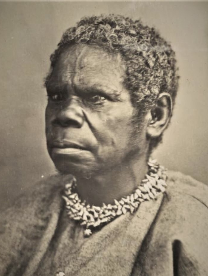 Sepia photograph of Aboriginal woman wearing shell necklace.