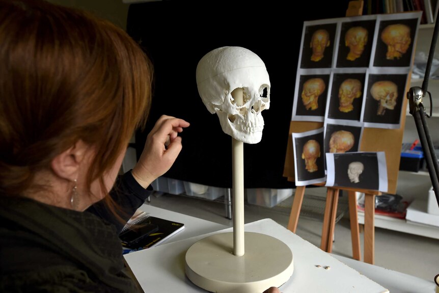 Sculptor Jennifer Mann with a reconstructed mummy head
