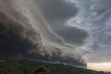 Imposing storm front over land