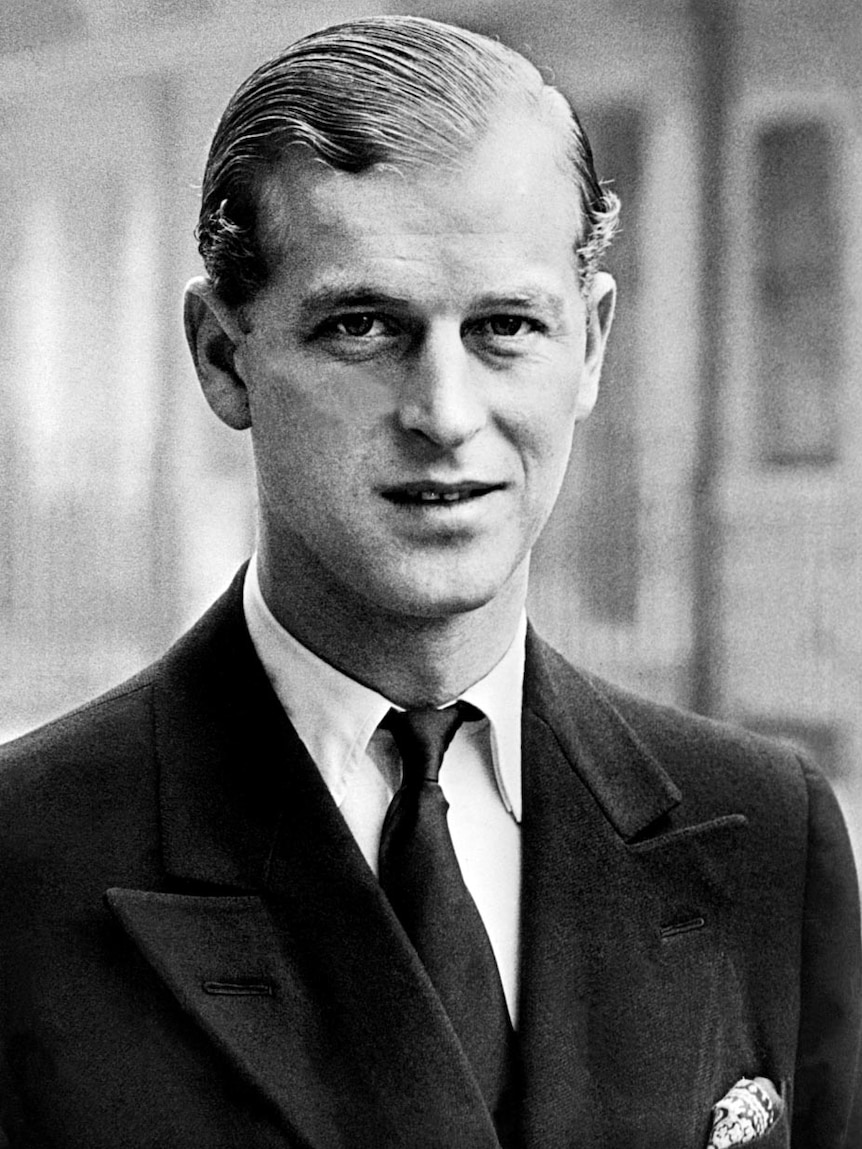 A black and white photograph of Prince Philip dressed in a suit in 1940.