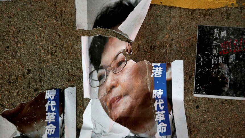 A torn poster of Hong Kong chief executive Carrie Lam