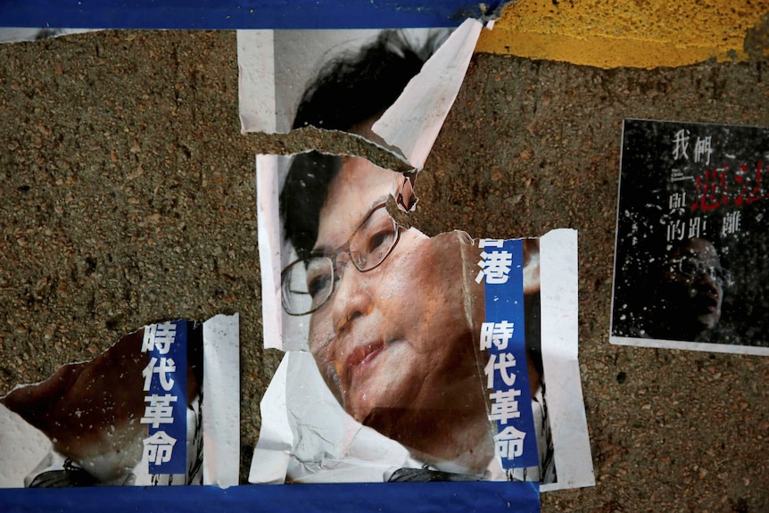 A torn poster of Hong Kong chief executive Carrie Lam