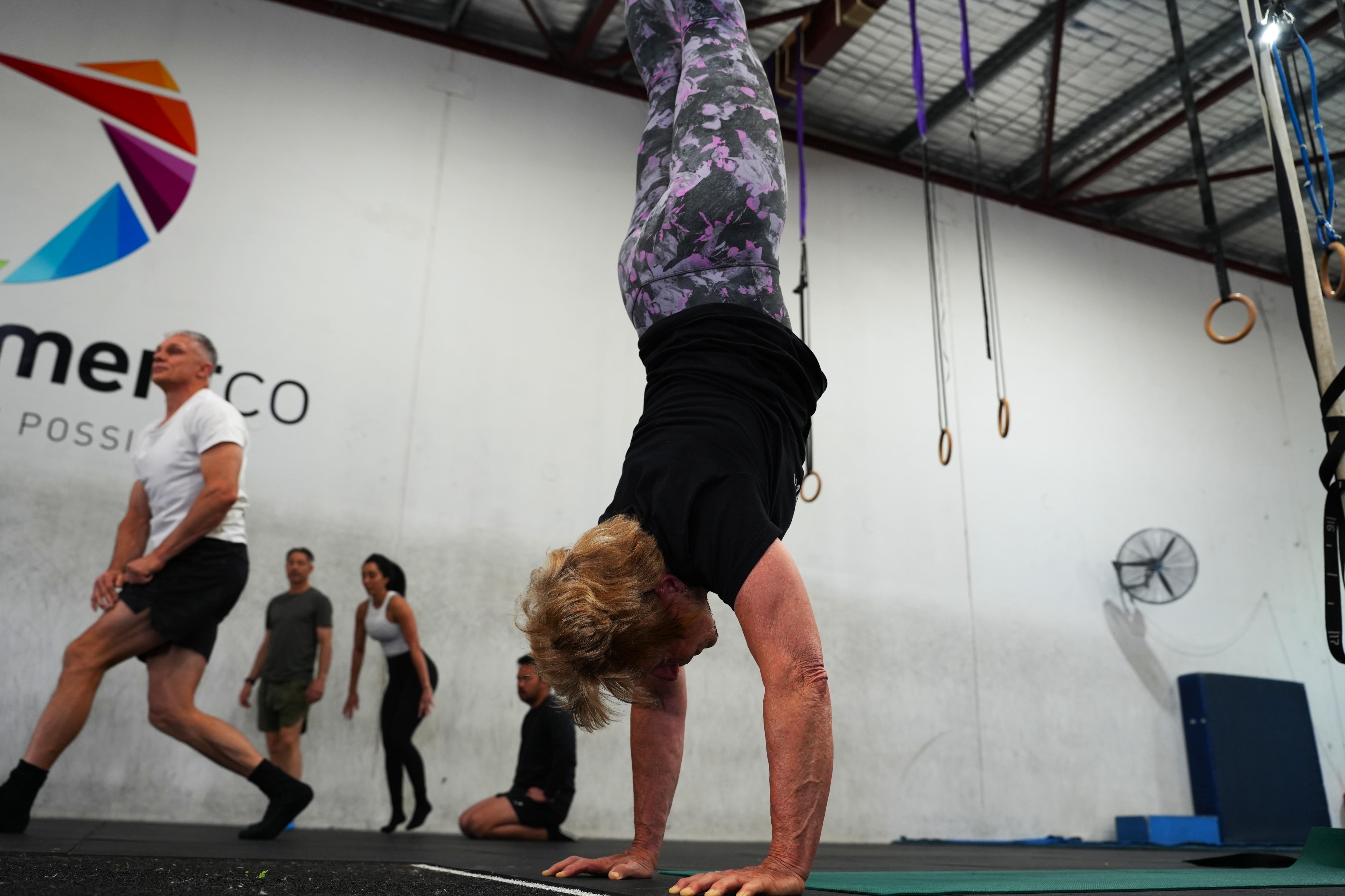 'Esther you can do that': Perth woman, 75, smashes handstand record