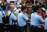 Protesters block the entrance to government buildings in Hong Kong