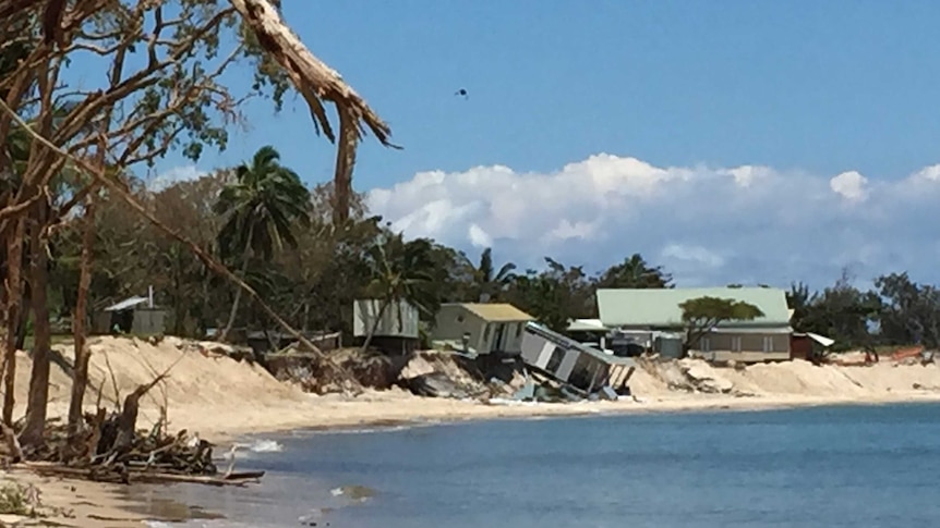 Holiday cabins toppled onto the beach because of the erosion.