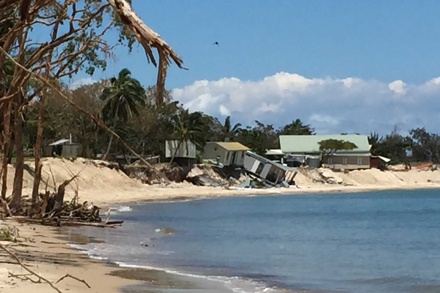 Holiday cabins toppled onto the beach because of the erosion.
