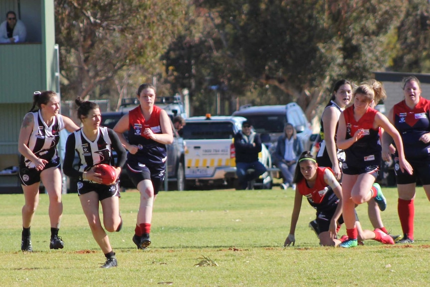 Two women's AFL teams play against each other in country Victoria.