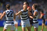 Gary Ablett of the Cats (2nd L) reacts after kicking a goal against Melbourne.