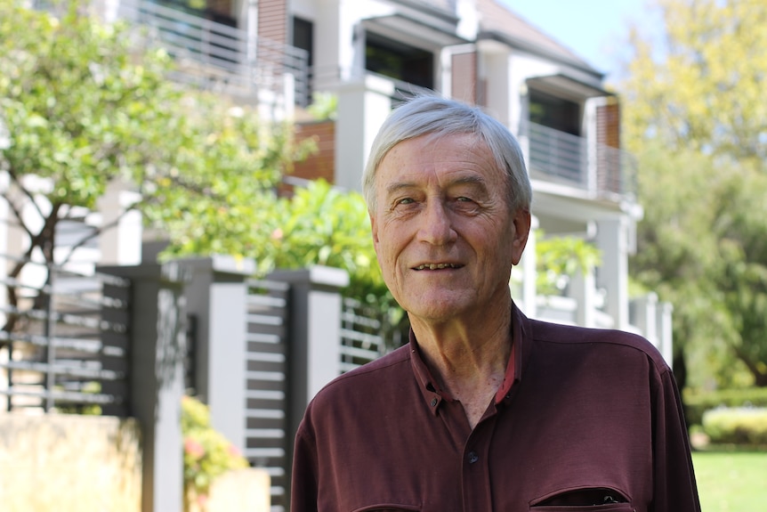 portrait of Peter Newman in front of medium density infill development