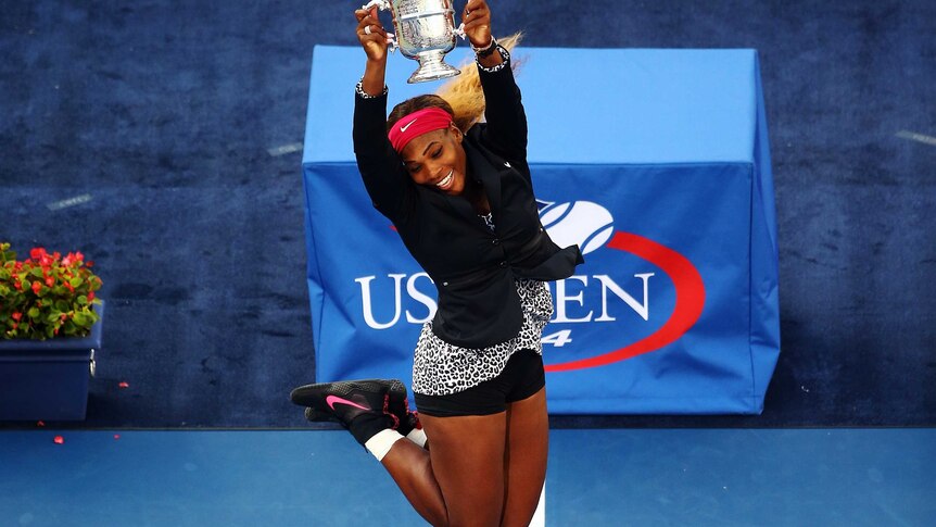 Serena Williams celebrates with US Open trophy