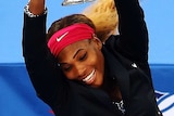 Serena Williams celebrates with US Open trophy