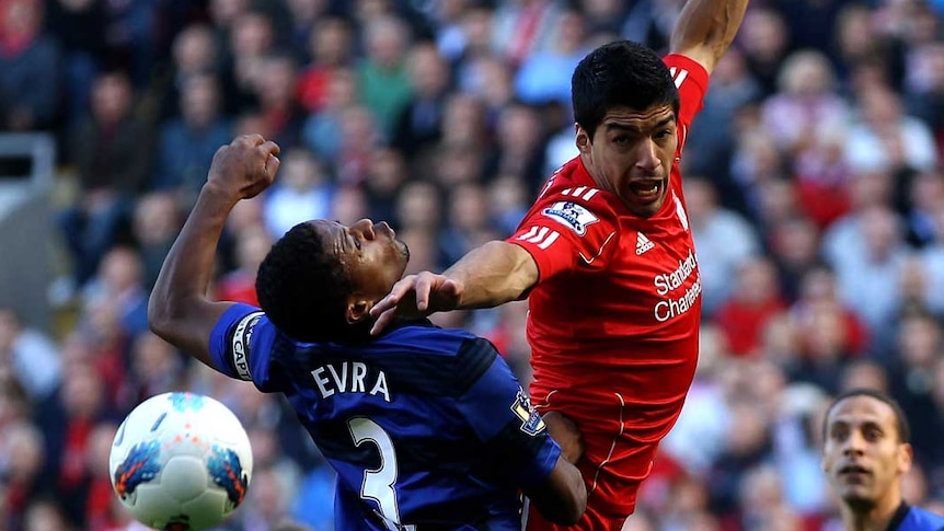 Evra and Suarez tussle at Anfield