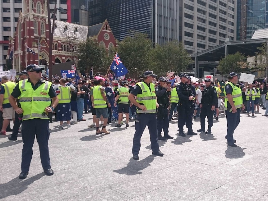 Police at Brisbane's Reclaim Australia rally, which was met by opposing groups