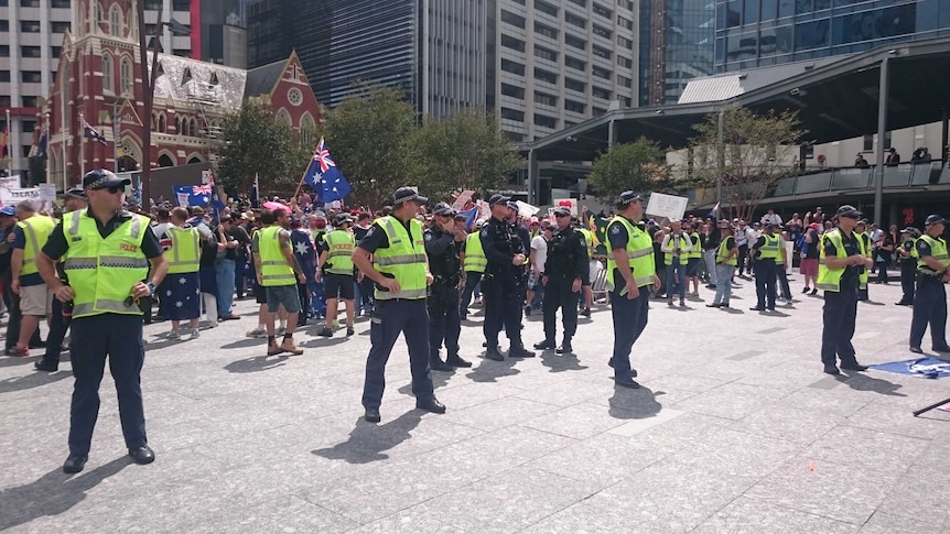 Police at Brisbane's Reclaim Australia rally, which was met by opposing groups