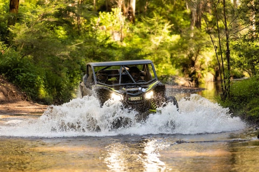 A car driving through water.