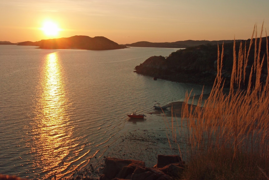 Sunset over a bay and islands.