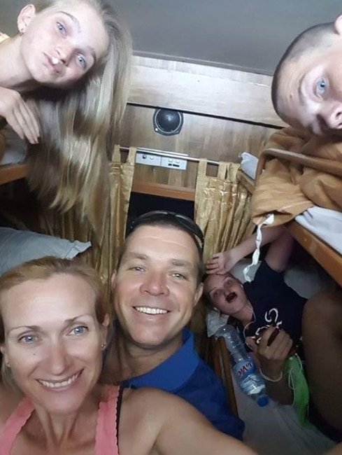 Roy Butler selfie surrounded by his family inside his caravan