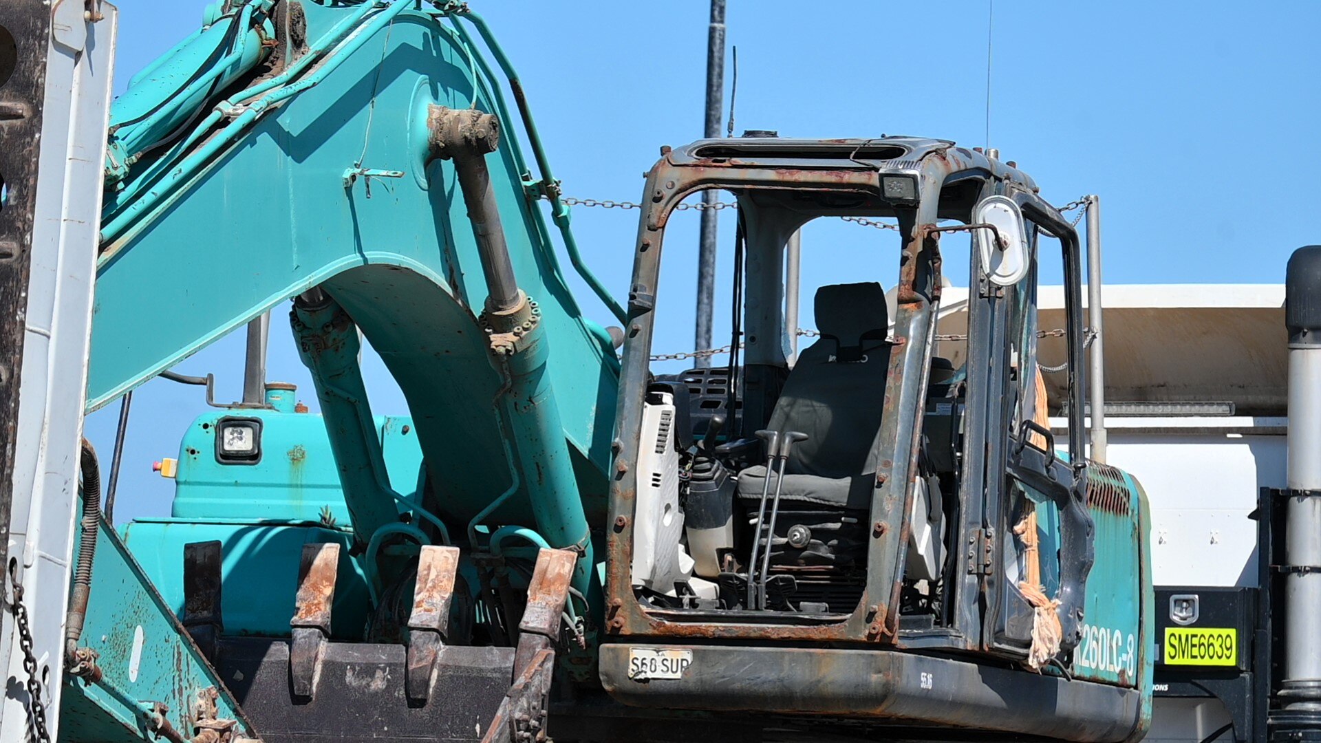 An excavator cab with no windows, front or doors