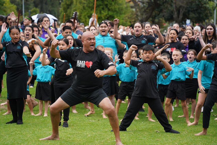 Maori people perform the haka