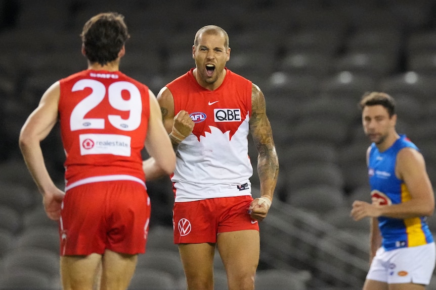 Sydney's Lance Franklin roars at the camera in celebration after kicking a goal against Gold Coast. 