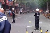Police at the scene of a blast in the capital of China's western region of Xinjiang.