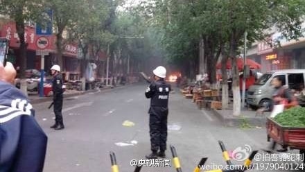 Police at the scene of a blast in the capital of China's western region of Xinjiang.