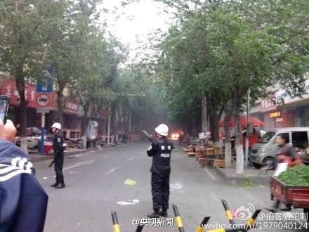 Police at the scene of a blast in the capital of China's western region of Xinjiang.