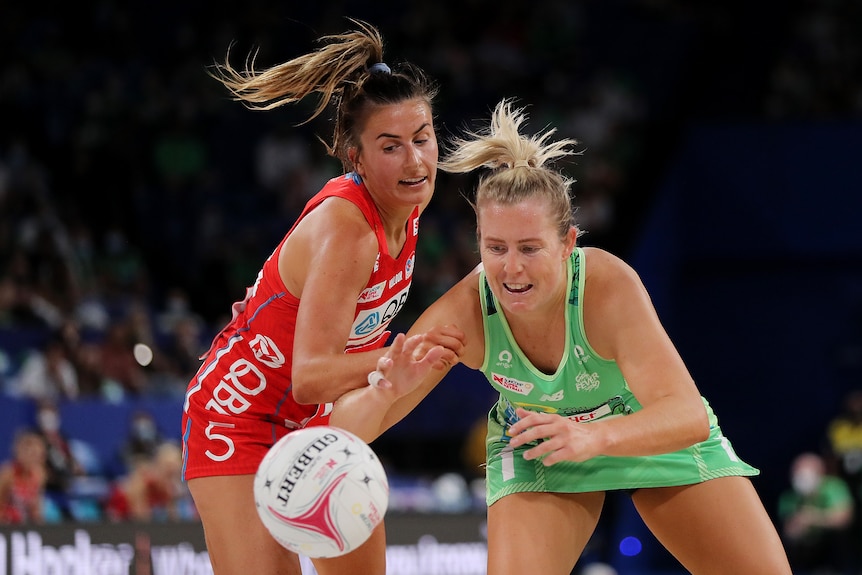 Maddy Proud and Jessica Anstiss fight for the ball