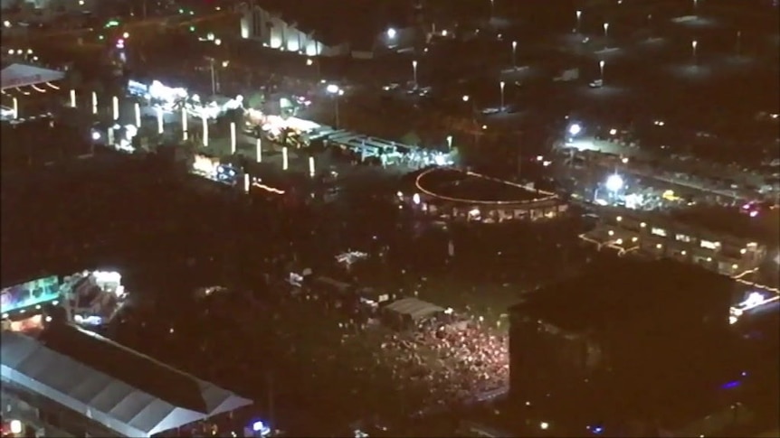 Footage taken from the Mandalay Bay Resort and Casino shows people running from the concert ground below