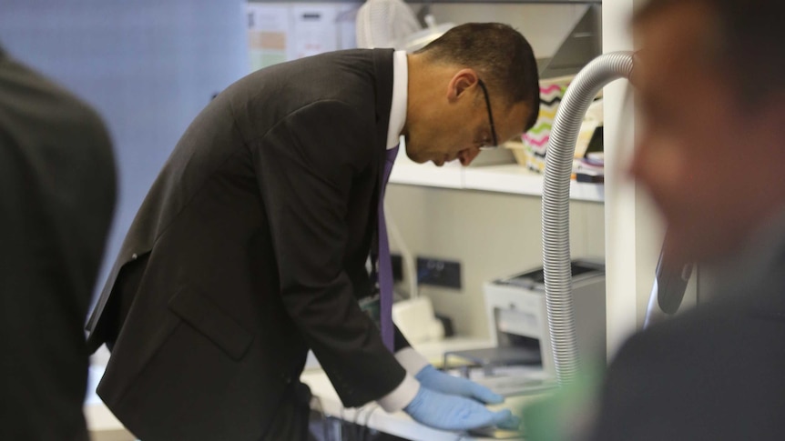 A man looks at a document