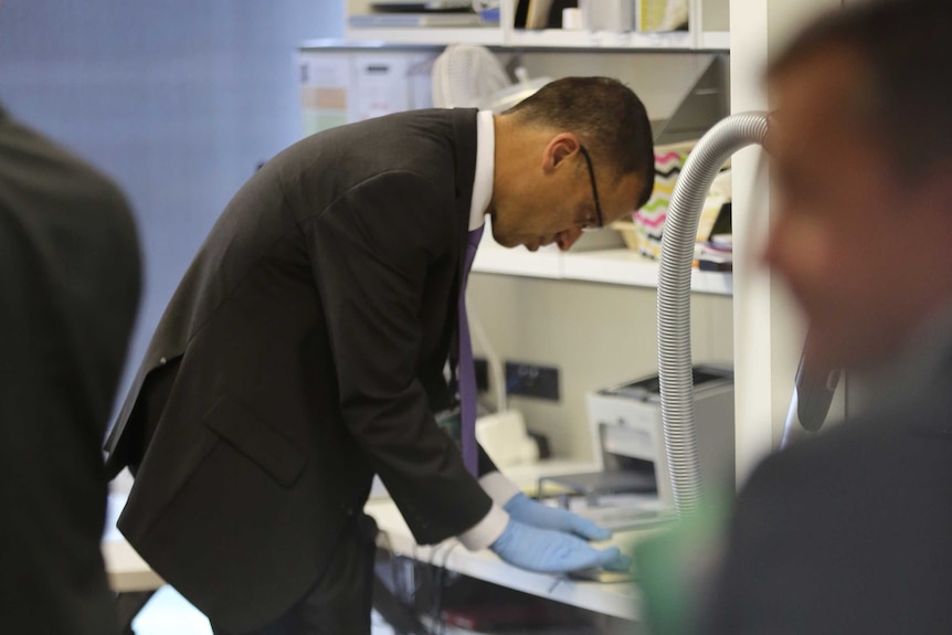 A man looks at a document