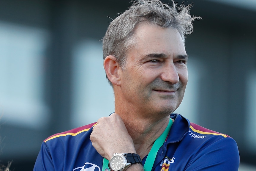 Andrew Wellington smiles while wearing a Lions club polo