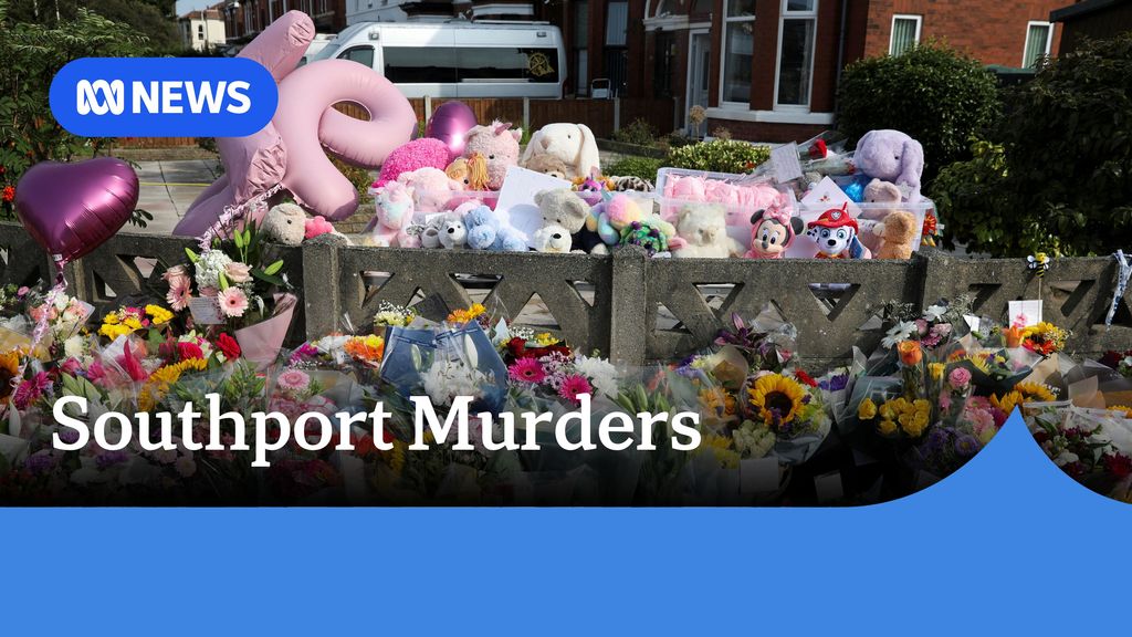 Southport Murders: A floral tribute against a low fence featuring flowers, stuffed toys and balloons.