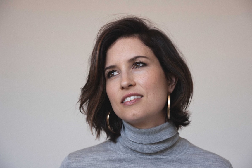 Missy Higgins stares into the distance in a close up and pensive shot