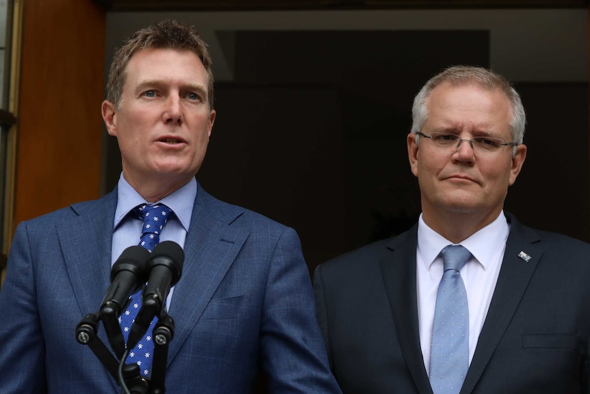 Mr Porter stands behind the lectern with Mr Morrison alongside him.