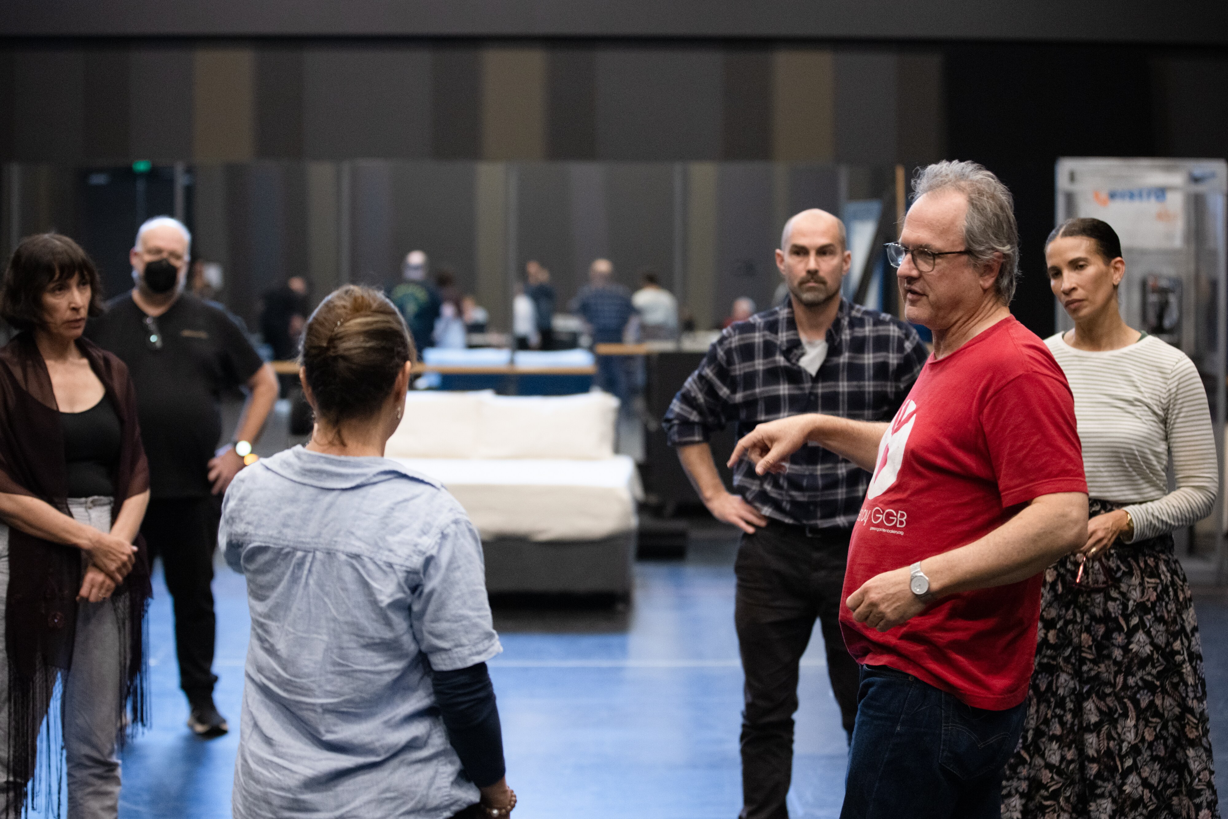 Director Humphrey Bower speaks to the actors during rehearsals.