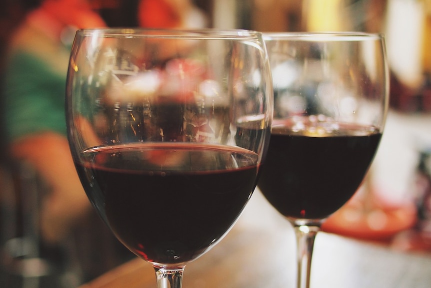 Two glasses of red wine.