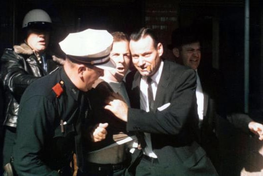 Lee Harvey Oswald is arrested at the Texas Theatre in Dallas, Texas, on November 22, 1963.