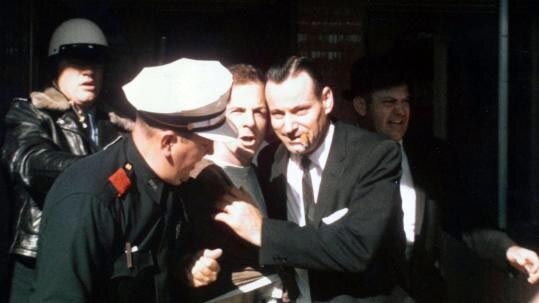 Lee Harvey Oswald is arrested at the Texas Theatre in Dallas, Texas, on November 22, 1963.