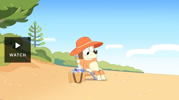 Still from Bluey episode Relax, showing Chilli Heeler sitting on a beach chair on the beach. Has Video