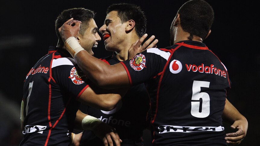 The Warriors celebrate a try