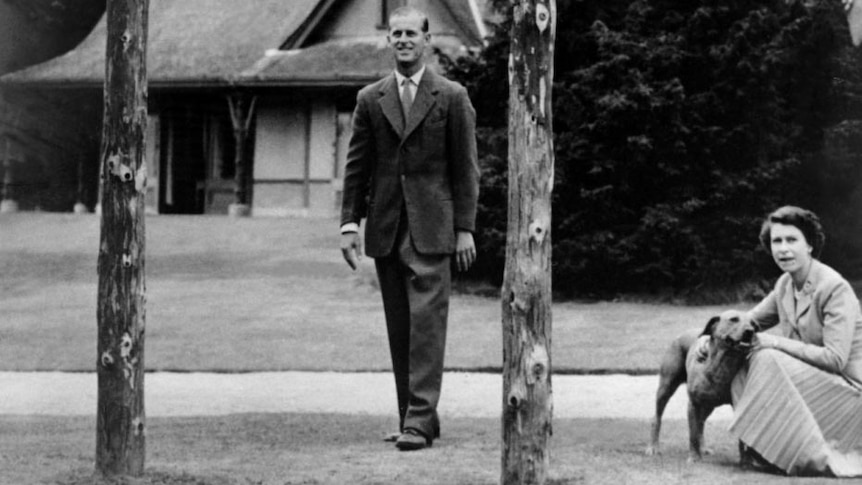 Queen Elizabeth II and Prince Philip and their two children, Charles and Anne, play at Balmoral.