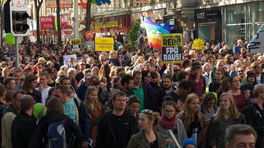 Protesters walk down Vienna street