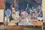 A mural inspired by a famous Tom Roberts painting depicting shearers and roustabouts in a shearing shed.