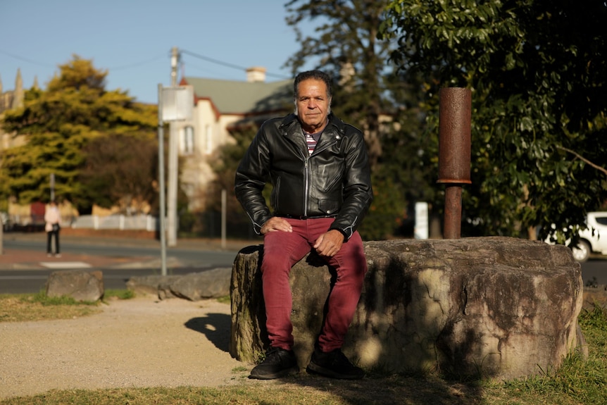 An Aboriginal man in a leather jacket