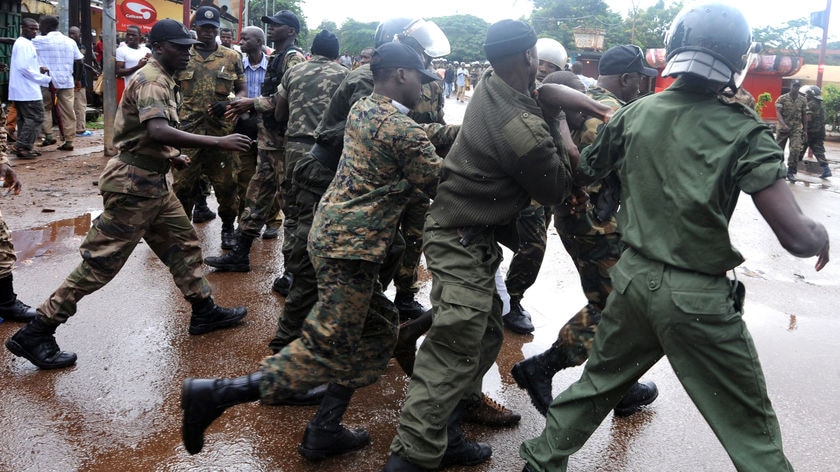 Guinean police arrest a protester