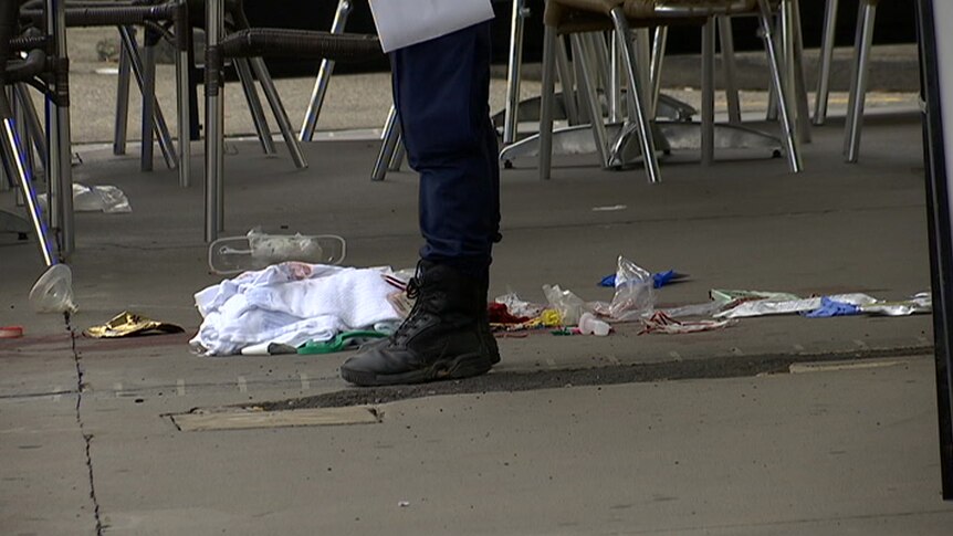 Blood-stained towels at the scene outside the salon