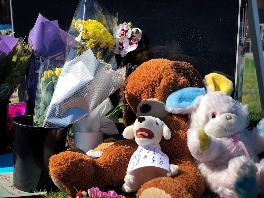 Toys, flowers and notes are left outside a home in Tootgarook.