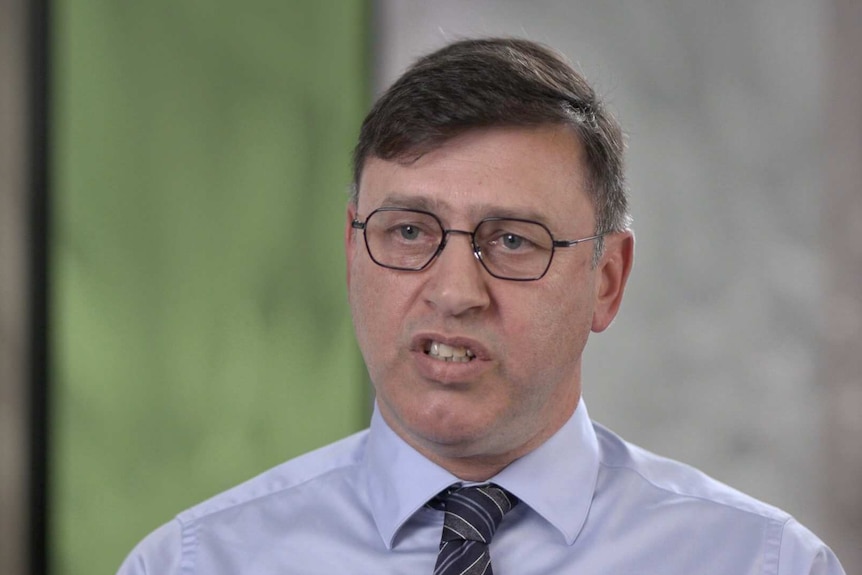 Close up of Andrew Gavrielatos, NSW Safe Work Executive Director, with blurred office background