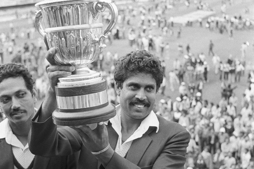 Kapil Dev holds up the World Cup